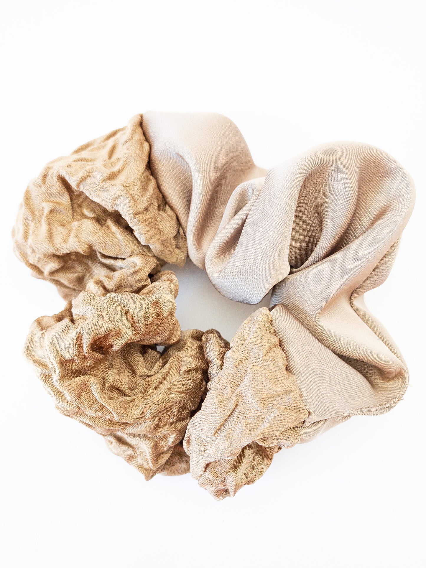 A beautiful large scrunchie with one half being a soft silk and the other a light ruffled texture. Choose from a lovely ivory or taupe color.