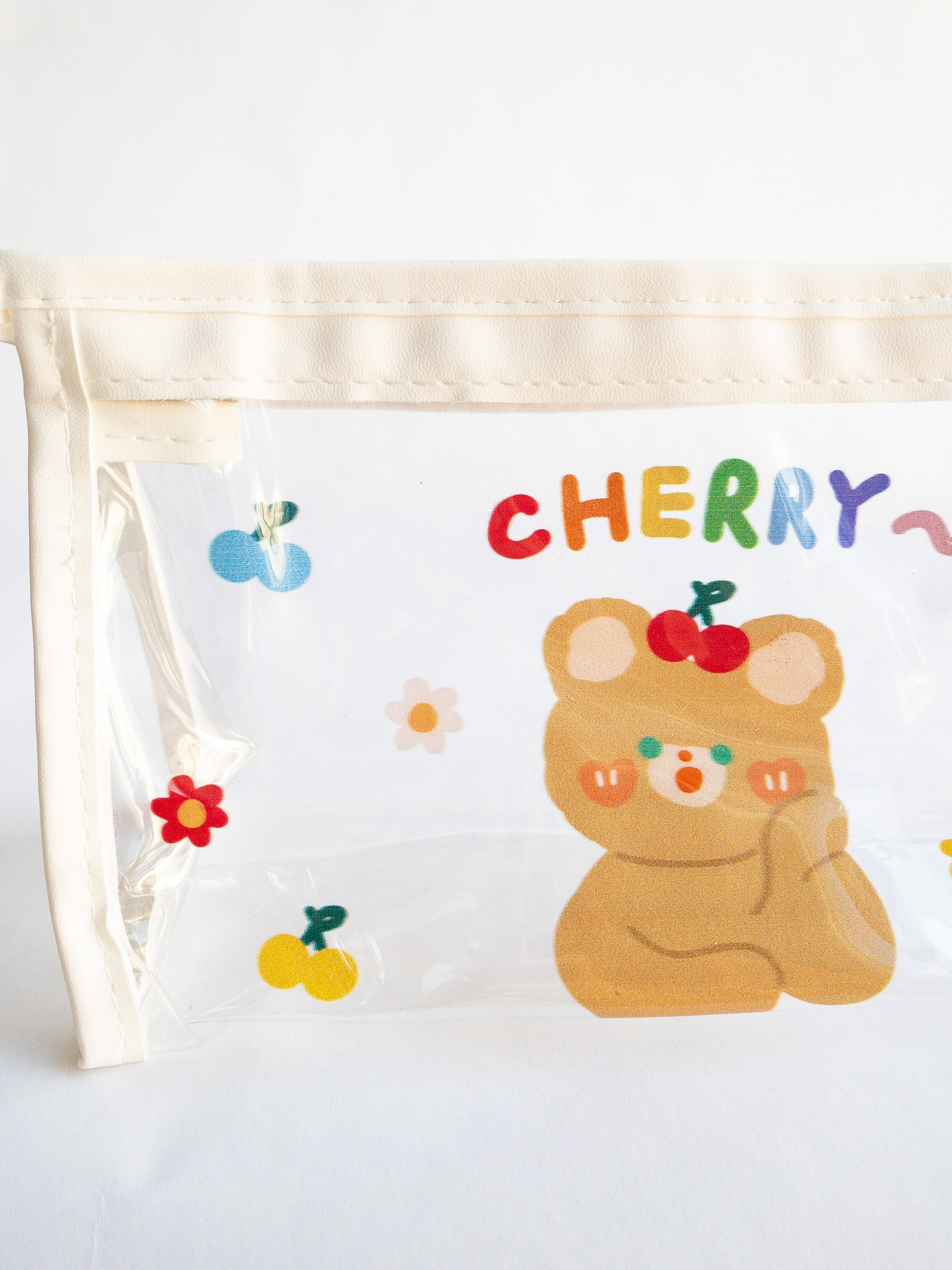 Have you wanted a storage pouch to take Eggy Cakes clips on the go? Here is the cutest little cherry bear pouch for just that! Use it to store your makeup, pencils, or hair clips. Clear pouch with an adorable bear, flower and cherries on one side.