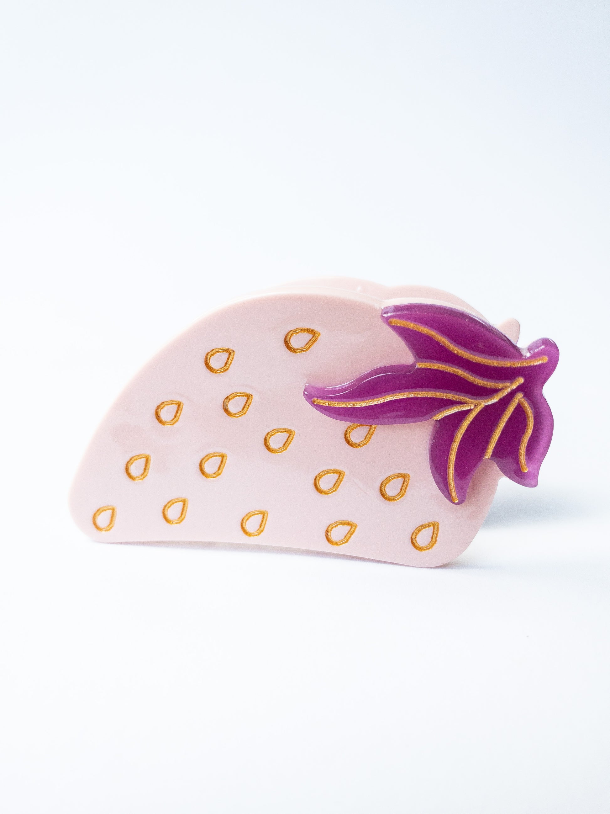Beautiful pink strawberry with purple and gold accents. Nothing brightens up your day like a fun strawberry! This hair claw clip is a medium size, great for half up hairstyles. 