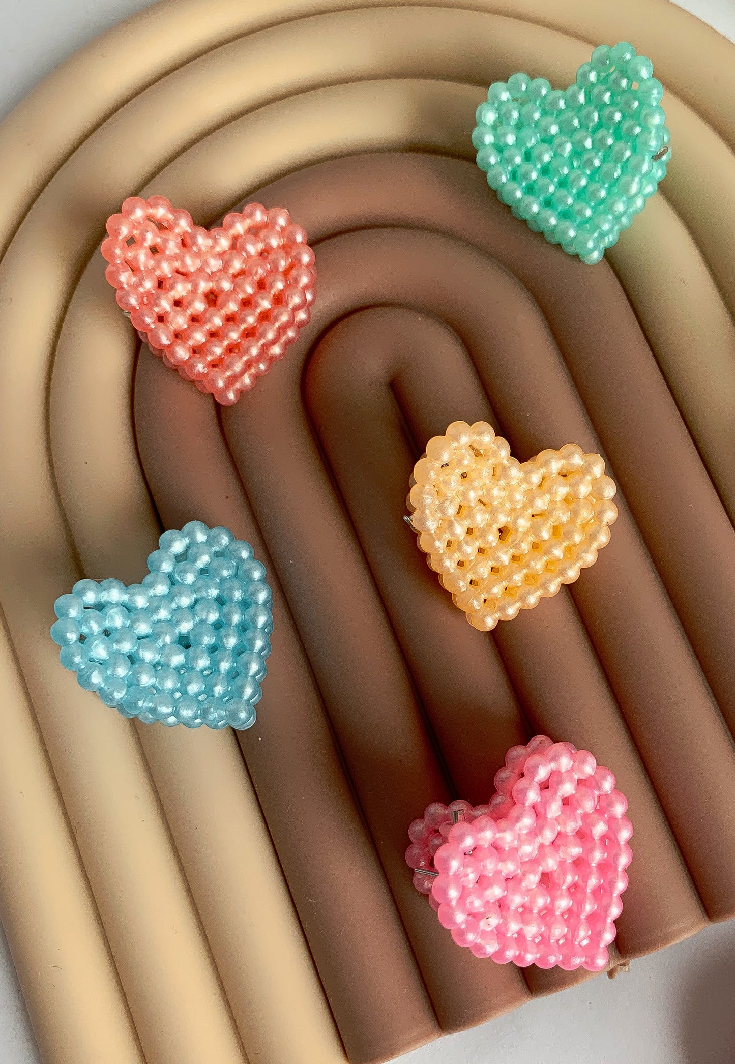 A pack of 6 small, romantic and tender heart claw clips. Each set comes with one of each color: blue, pink, purple, light orange, teal, and rose.