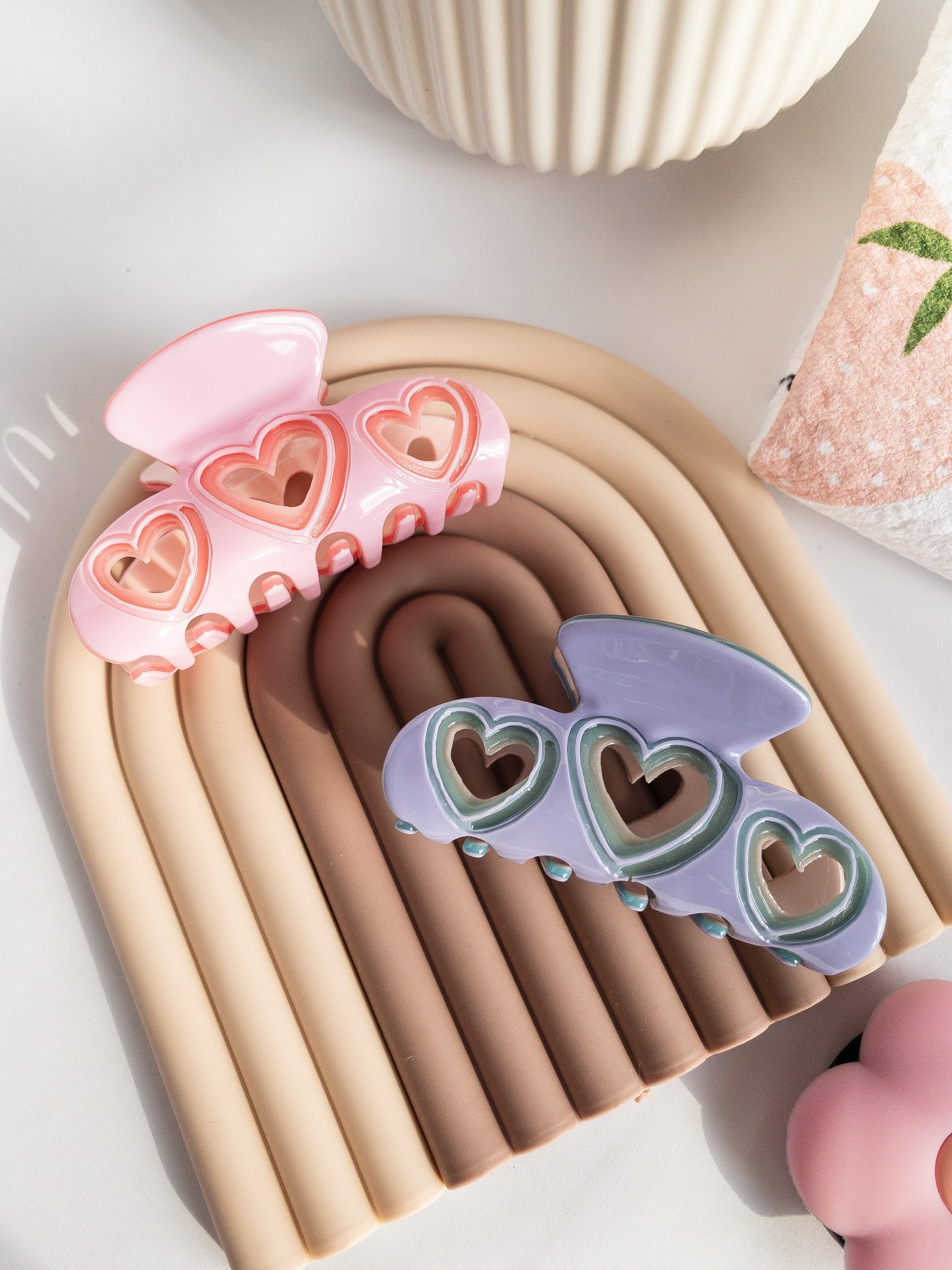 The hair claw clip for the sweethearts. The perfect medium size for half up hairstyles, strong and durable. Your hair is highlighted by the cut out hearts on each side. A beautiful sweet tart jam purple color with a lighter teal outline throughout. 