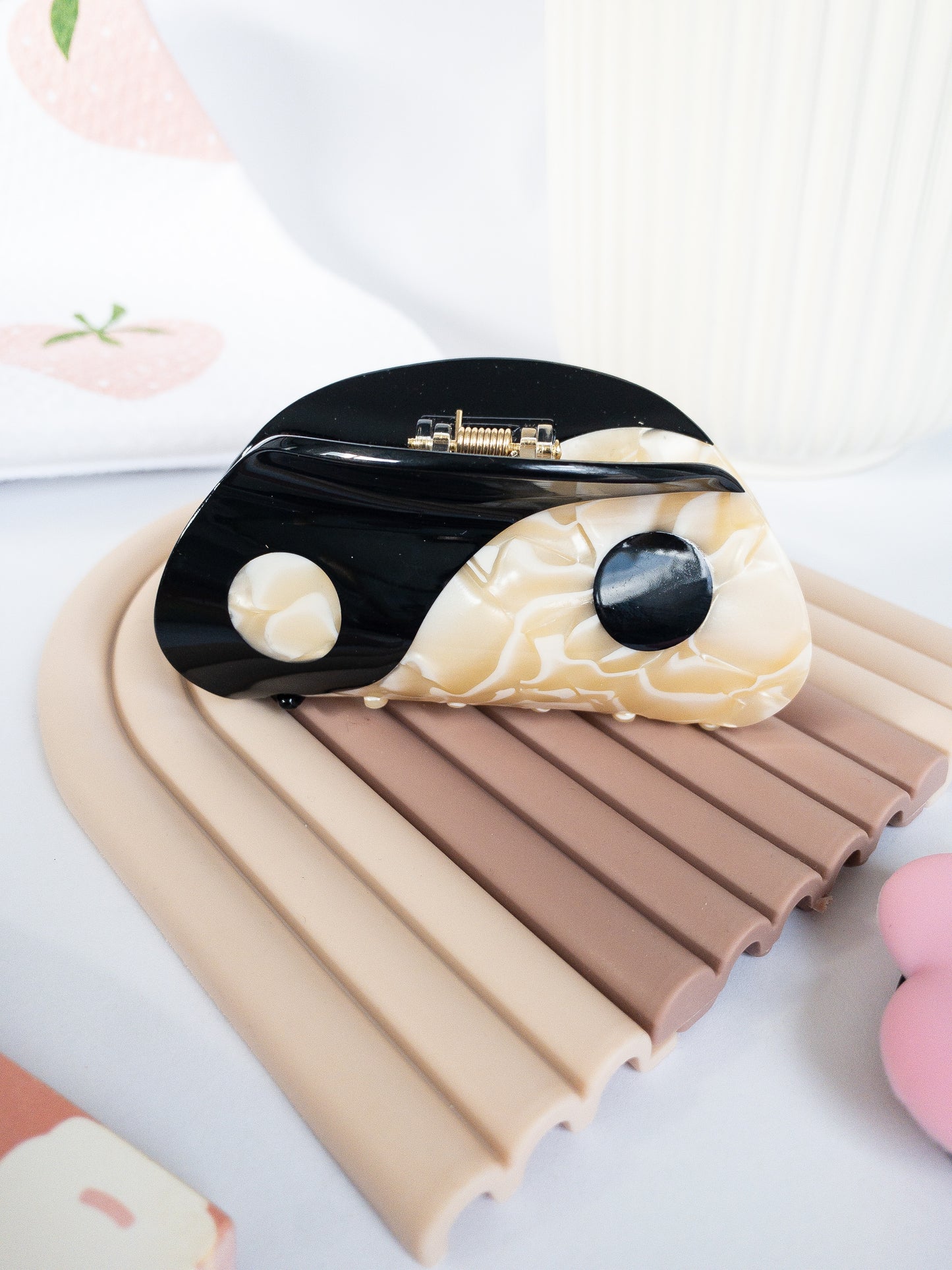 Large yin yang hair claw clip in a beautiful swirl of cream white and midnight black colors. This claw is shiny and strong, a great everyday staple